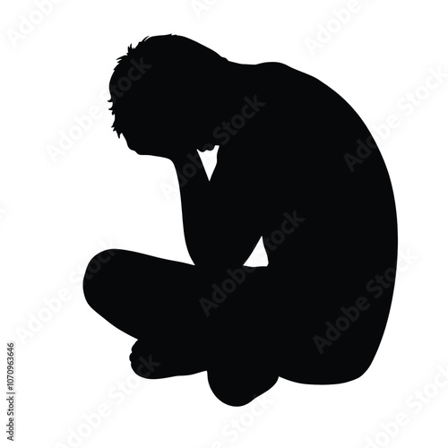 a black silhouette of a person sitting on the ground. The person is sitting with their legs crossed and their head resting on their knees