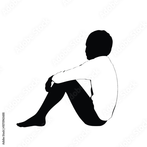 a black silhouette of a person sitting on the ground. The person is sitting with their legs crossed and their head resting on their knees