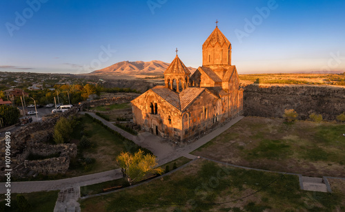 Aerial view of Hovhannavank monastery and Ohanavan village. Mount Ara, medieval church and Kasakh gorge and river canyon on sunny autumn sunset. Aragatsotn Province, Armenia. Europe. photo