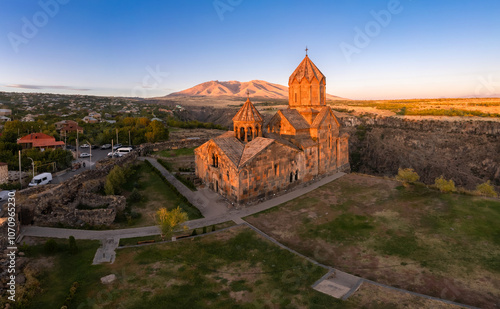 Aerial view of Hovhannavank monastery and Ohanavan village. Mount Ara, medieval church and Kasakh gorge and river canyon on sunny autumn sunset. Aragatsotn Province, Armenia. Europe. photo