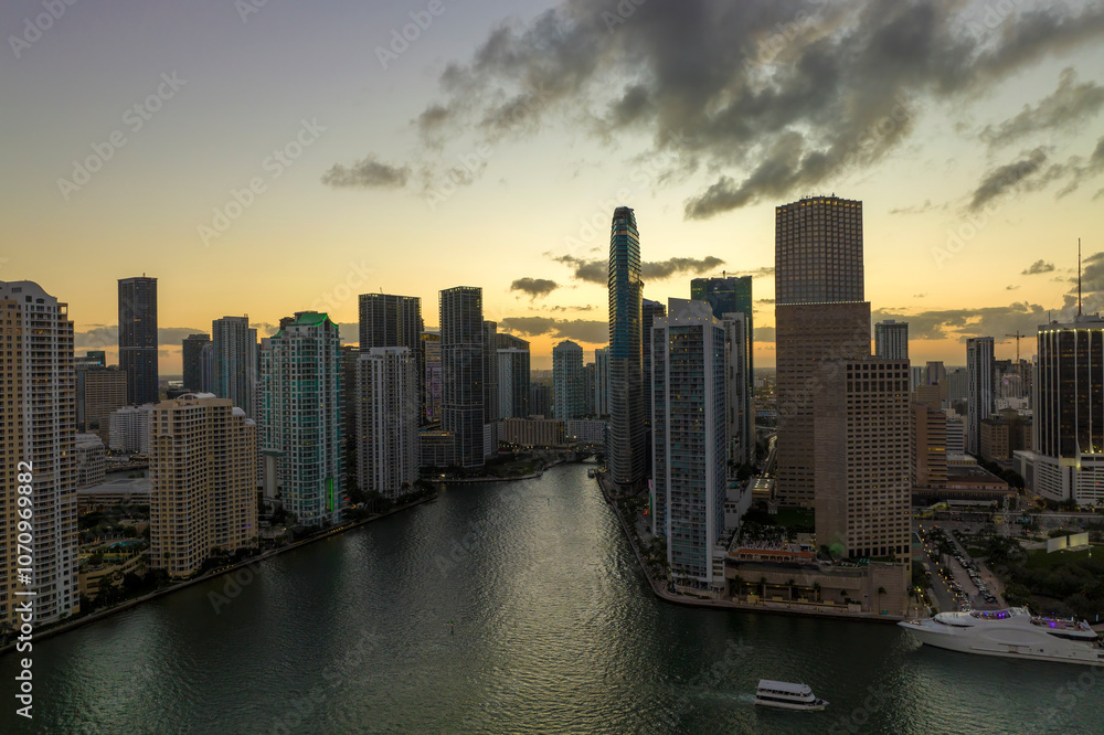 Fototapeta premium Evening urban landscape of downtown district of Miami Brickell in Florida, USA. Skyline with dark high skyscraper buildings in modern american megapolis