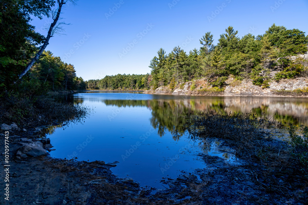 The serene beauty of MacDonald Lake in Ontario, featuring tranquil waters and lush forests, perfect for nature lovers and outdoor enthusiasts. The serene beauty of MacDonald Lake in Ontario, featuring tranquil waters and lush forests, perfect for nature lovers and outdoor enthusiasts.