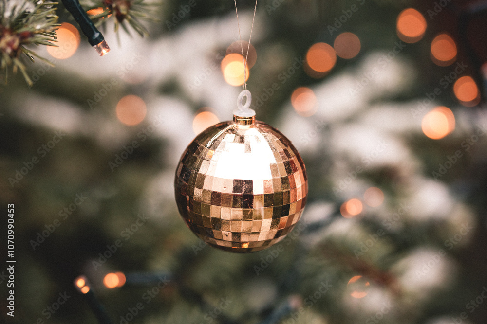golden christmas ornament on fir tree golden christmas ornament on fir tree