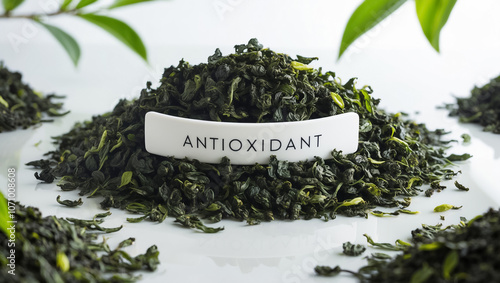 Green tea dry with a sign with the inscription antioxidant photo