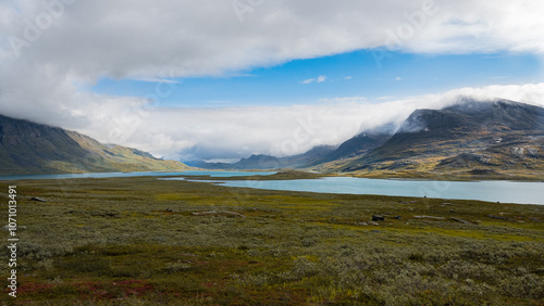 Obraz na plátně Breathtaking scenic view to the wide mountain valley with lakes and mountains on horizon, splendid scandinavia landscape seen while hiking Kungsleden trail in nordic nature of swedish Lapland