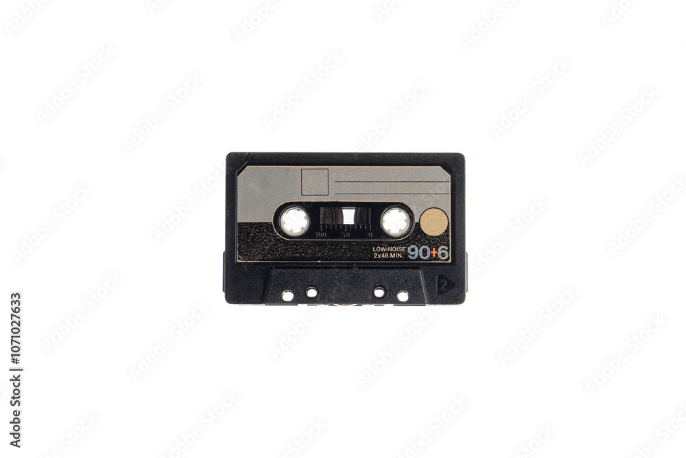 Close-up of an audio cassette with a sticker without text. Analog storage medium. Cassettes for audio recordings and music. Close-up of an audio cassette with a sticker without text. Analog storage medium. Cassettes for audio recordings and music.