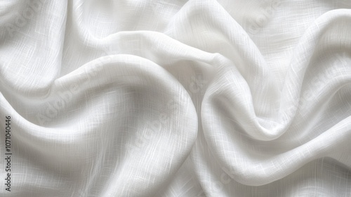 Close-up of soft, flowing white fabric with subtle texture, ideal for backgrounds or textile design.