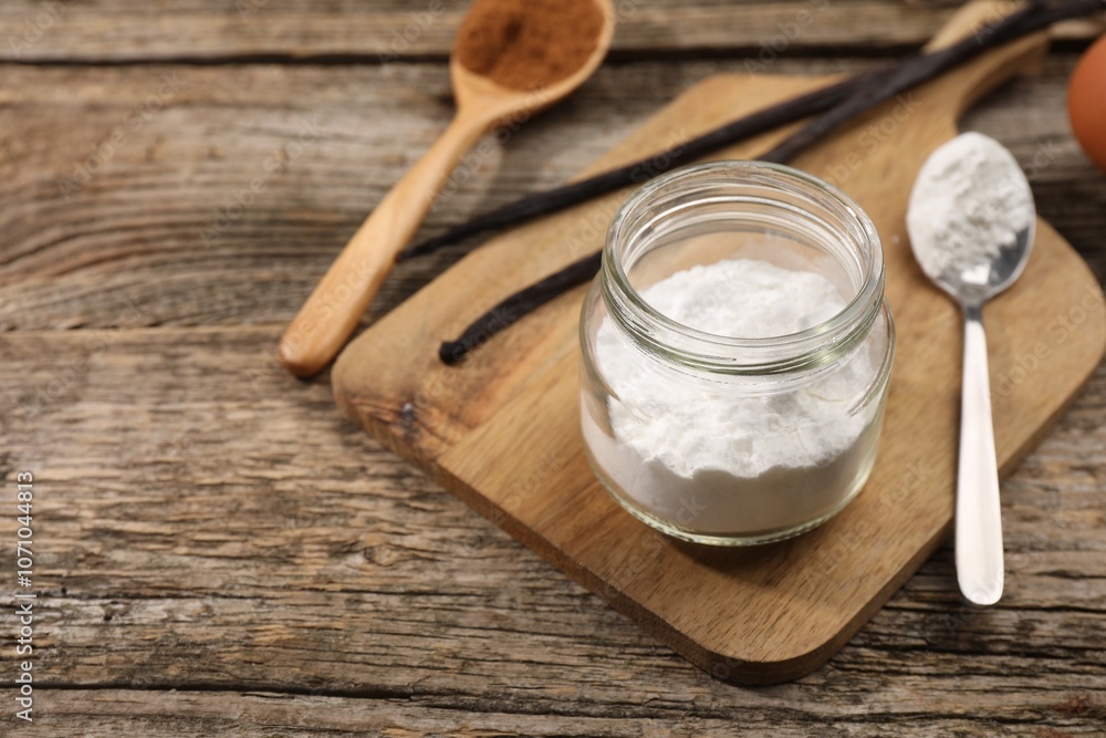 Baking powder in jar on wooden table, closeup. Space for text Baking powder in jar on wooden table, closeup. Space for text