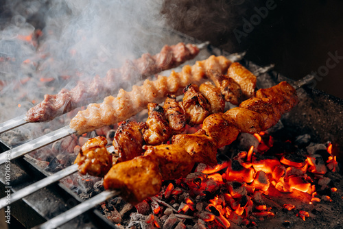 Tender marinated chicken skewers grilling over hot charcoal for a perfect barbecue flavor photo