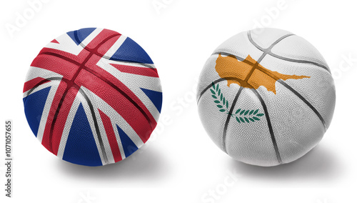 basketball balls with the national flags of cyprus and great britain on the white background. photo