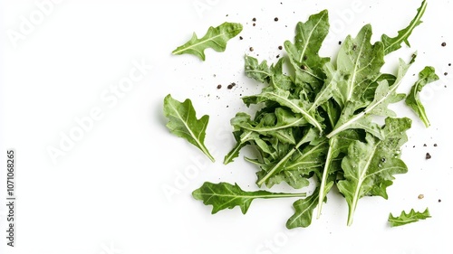 Fresh dandelion greens scattered on a clean surface, showcasing their vibrant green color and jagged edges, ideal for salads or healthy dishes.