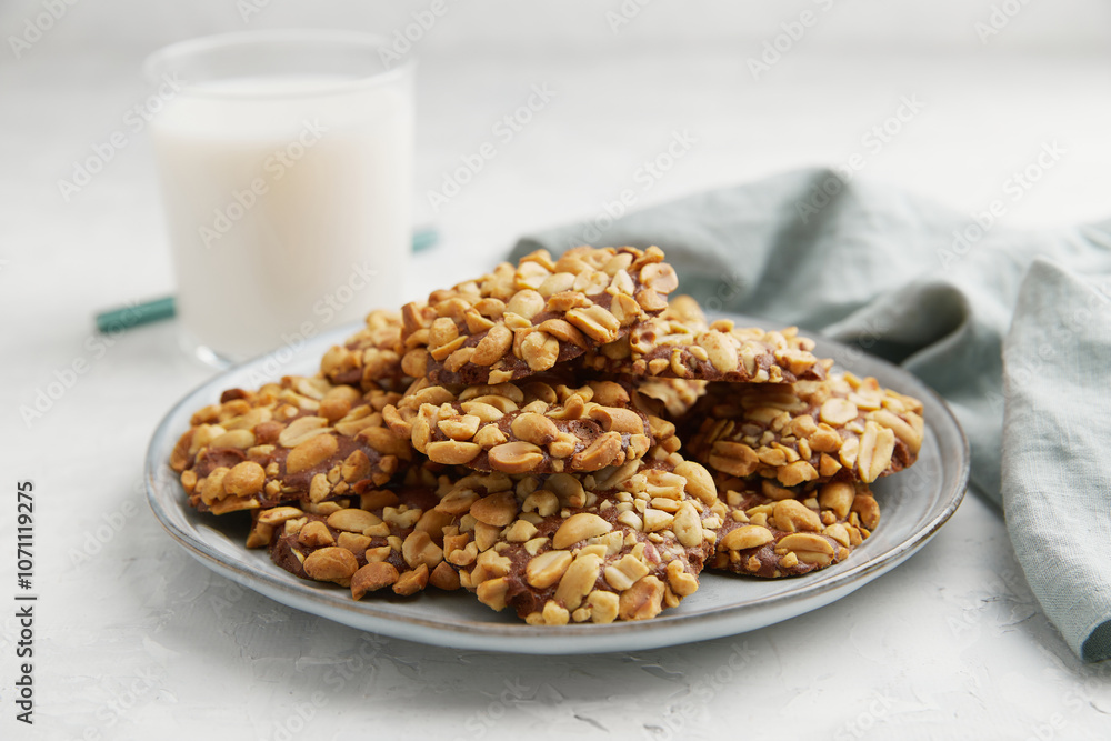 A heap of Portugues traditional peanut cookies known as Bolachas de Amendoim on the grey plate A heap of Portugues traditional peanut cookies known as Bolachas de Amendoim on the grey plate
