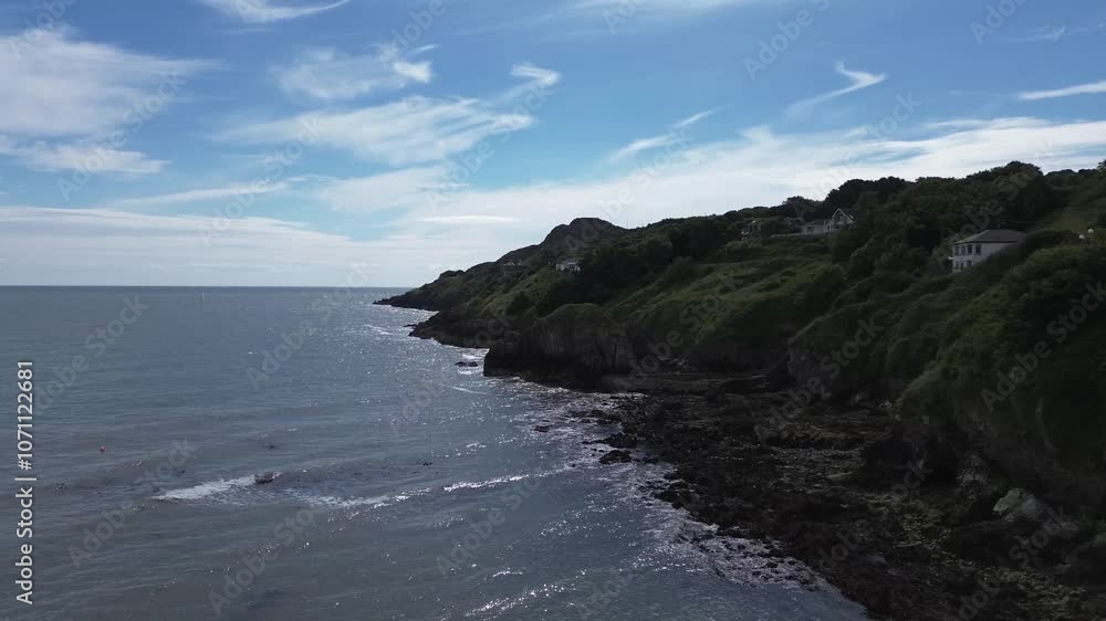 Coastal drone video of a part of Howth Head, a peninsula located northeast of the city of Dublin, Ireland. Coastal drone video of a part of Howth Head, a peninsula located northeast of the city of Dublin, Ireland.