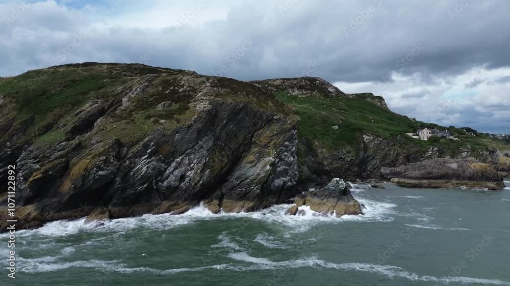 Coastal drone video of a part of Howth Head, a peninsula located northeast of the city of Dublin, Ireland. Coastal drone video of a part of Howth Head, a peninsula located northeast of the city of Dublin, Ireland.