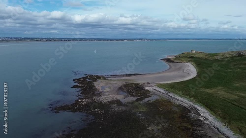 Amazing drone video around Ireland's Eye, a small long-uninhabited island off the coast of County Dublin, Ireland., near Howth village and harbour, with a small martello tower.