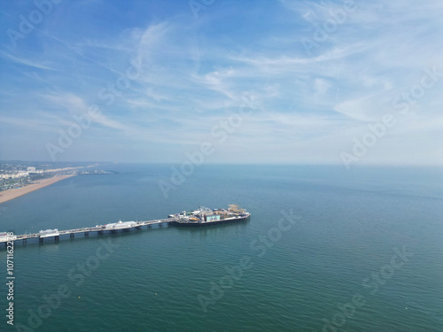 Aerial View of British Tourist Attraction of Beach and Ocean at Brighton and Hove Coastal City of England United Kingdom. High angle Footage of British Tourist Attraction Was Captured on May 9th, 2024