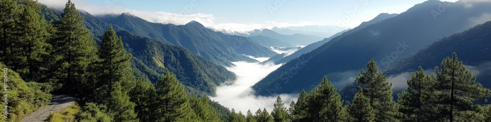 Obraz premium Breathtaking Mountain Landscape with Lush Green Forests and Majestic Peaks Overlooking Serene Valley and Cloud-Covered Sky for Nature Travel Adventure Photography