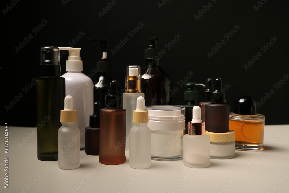 Assorted Skincare Bottles and Cream Jars in Minimalist Product Display Assorted Skincare Bottles and Cream Jars in Minimalist Product Display