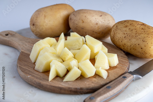 Chopped Potatoes on Wooden Cutting Board