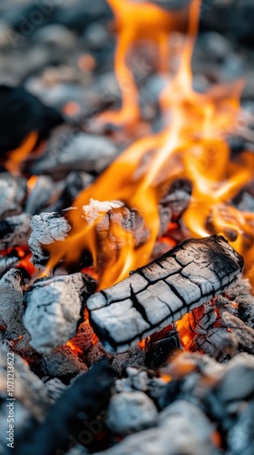 Macro view of burning coals and flames in a rotary kiln photo