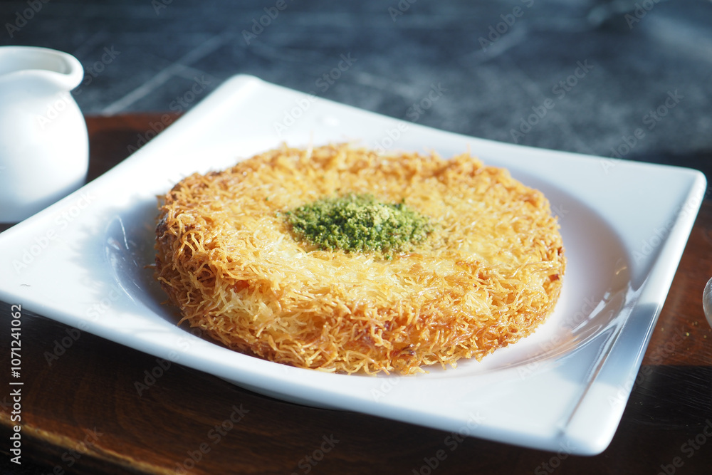 Turkish dessert kunefe, kunafa, kadayif with pistachio Turkish dessert kunefe, kunafa, kadayif with pistachio