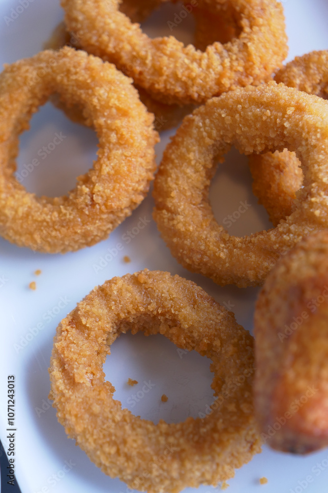 Deliciously Crispy Golden Fried Onion Rings Served Beautifully on a Plate for You Deliciously Crispy Golden Fried Onion Rings Served Beautifully on a Plate for You