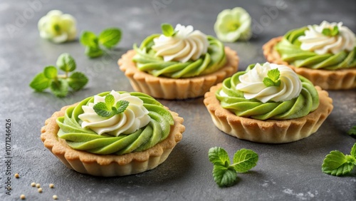 Elegant shortcrust pastry tarts with cream flower and matcha flavor, decorated with green accents, pastry, dessert, sweets, tarts photo