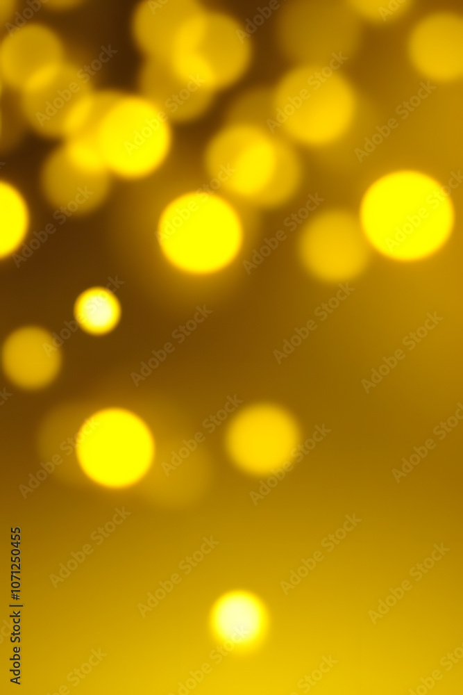 Obraz premium Ethereal Yellow Bokeh Lights Abstract Background
