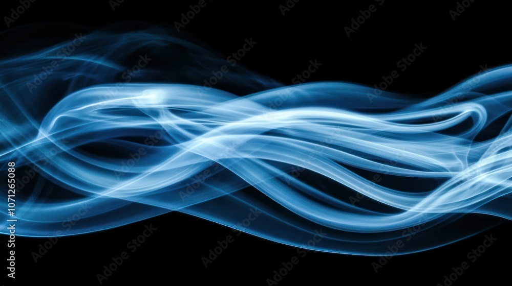 Blue smoke rising in soft, ethereal tendrils against a black background. Blue smoke rising in soft, ethereal tendrils against a black background.