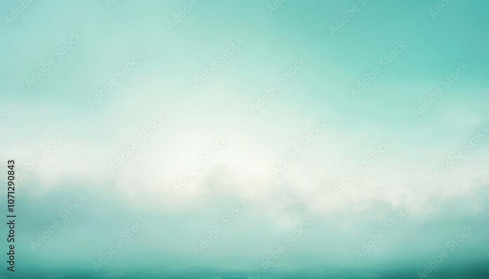 Fototapeta premium A Foggy Teal Sky With Sunlight Glowing Through Clouds