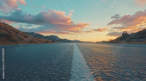 Asphalt road and mountain with sky clouds background at sunset