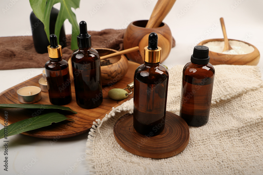 Amber Glass Dropper Bottle with Wooden Spa Bowls and Natural Decor Amber Glass Dropper Bottle with Wooden Spa Bowls and Natural Decor