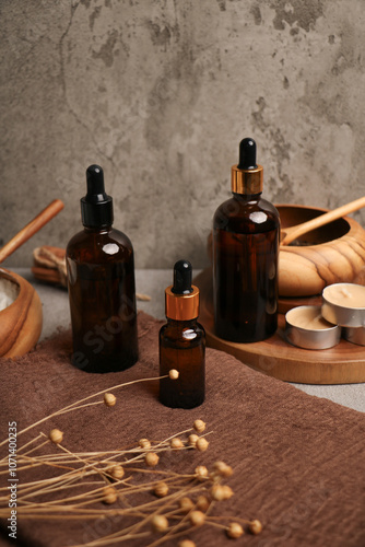 Amber Glass Dropper Bottles with Wooden Bowls and Rustic Natural Decor photo