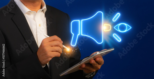 Brand visuality icon, Public Relations concept for construction, Investment, business development and Engineering. Businessman shows glowing neon line of megaphone with eye icon on virtual screen. photo