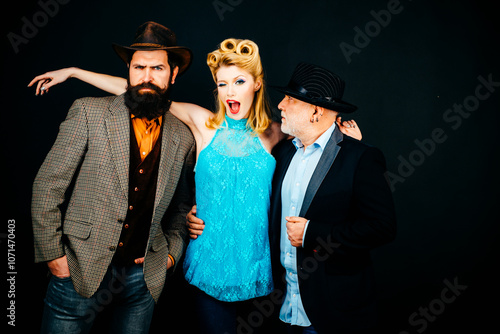 Group of fashion models posing in studio. Group of tree different ages People. Funny Friends face. Three different ages people portrait. Fun Great team. Group of three cheerful people. photo