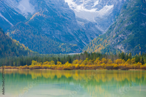 Stunning landscape and reflection of Landro lake in autumn, Dolomite Italy. photo