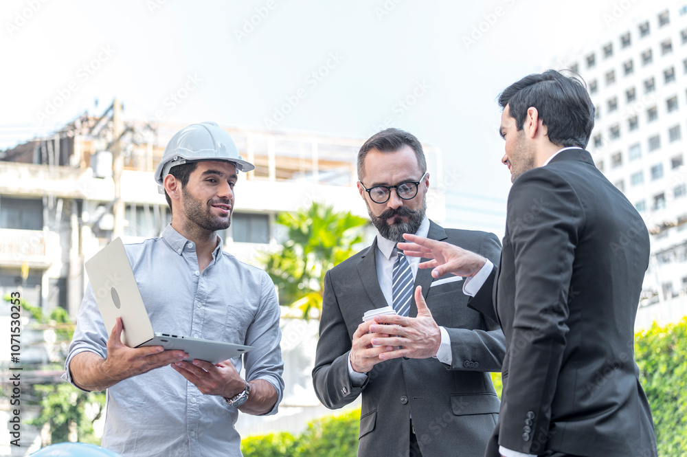 Two Businessman and power engineering talking and checking quality power solar cell with laptop computor on site new project power solution business