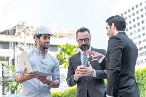 Obraz na płótnie Two Businessman and power engineering talking and checking quality power solar cell with laptop computor on site new project power solution business w salonie