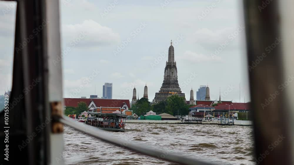 view from the water of an ancient Buddhist temple in Thailand