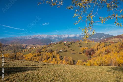 Scenic autumn overview of Magura village in Romania, near the Piatra Craiului mountains photo