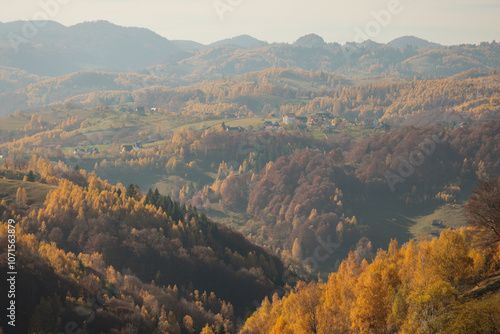 Scenic autumn overview of Magura village in Romania, near the Piatra Craiului mountains photo