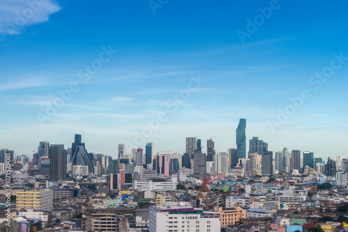 Obraz na płótnie Modern Skyscraper of business center district at Bangkok skyline with blue sky background, Bangkok city is modern metropolis and favorite of tourists of Thailand w salonie
