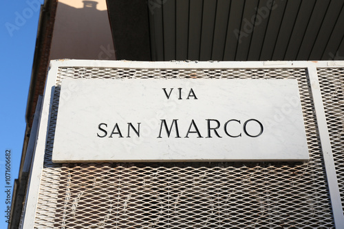 Label plate with text VIA SAN MARCO that means SAINT MARK STREET in italian language photo