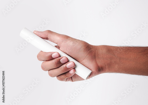 Closeup Photo Of A Male Hand Holding A New White PVC Plastic Pipe Isolated On White Background