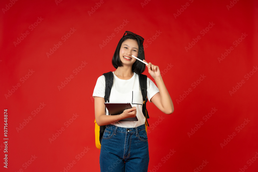 A studio photoshoot captures the image of an Asian teenage school girl surrounded by educational materials, representing her enthusiasm for knowledge and her journey toward academic excellence. A studio photoshoot captures the image of an Asian teenage school girl surrounded by educational materials, representing her enthusiasm for knowledge and her journey toward academic excellence.