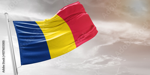 Chadnational flag cloth fabric waving on beautiful grey Background.