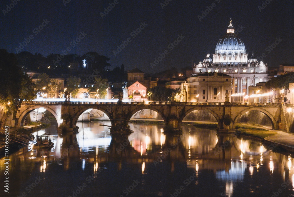 st peters basilica in Vatican city at night over Tevere river