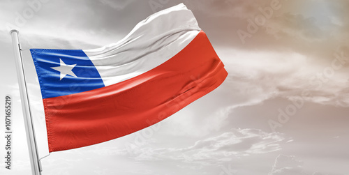Chile national flag cloth fabric waving on beautiful grey Background.