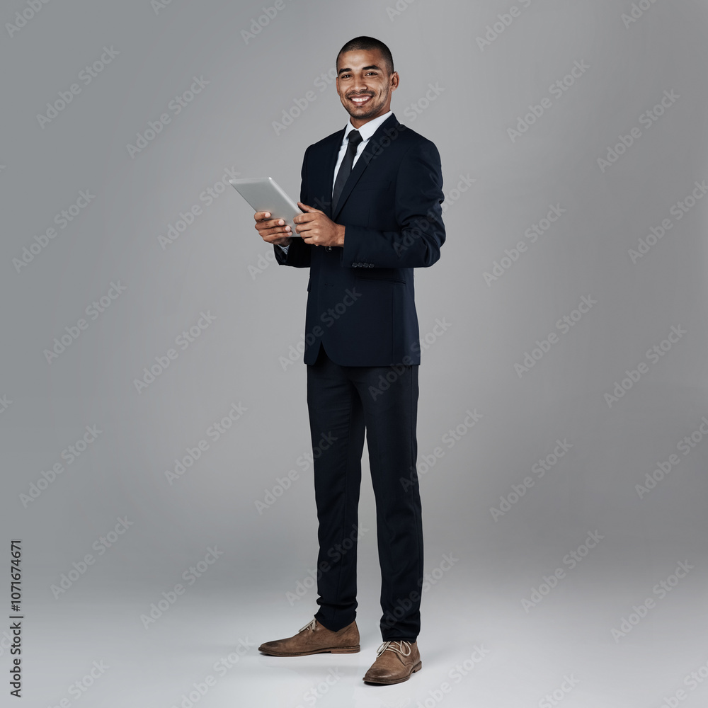 Studio, businessman and portrait with tablet for career, online information and review update for case. Mockup space, male lawyer and smile with digital for email feedback, justice or gray background Studio, businessman and portrait with tablet for career, online information and review update for case. Mockup space, male lawyer and smile with digital for email feedback, justice or gray background