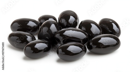 Shiny black olives, isolated on white background, perfect for Mediterranean themes photo